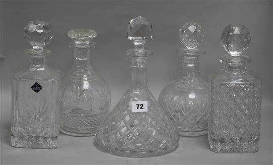 A collection of cut glass decanters